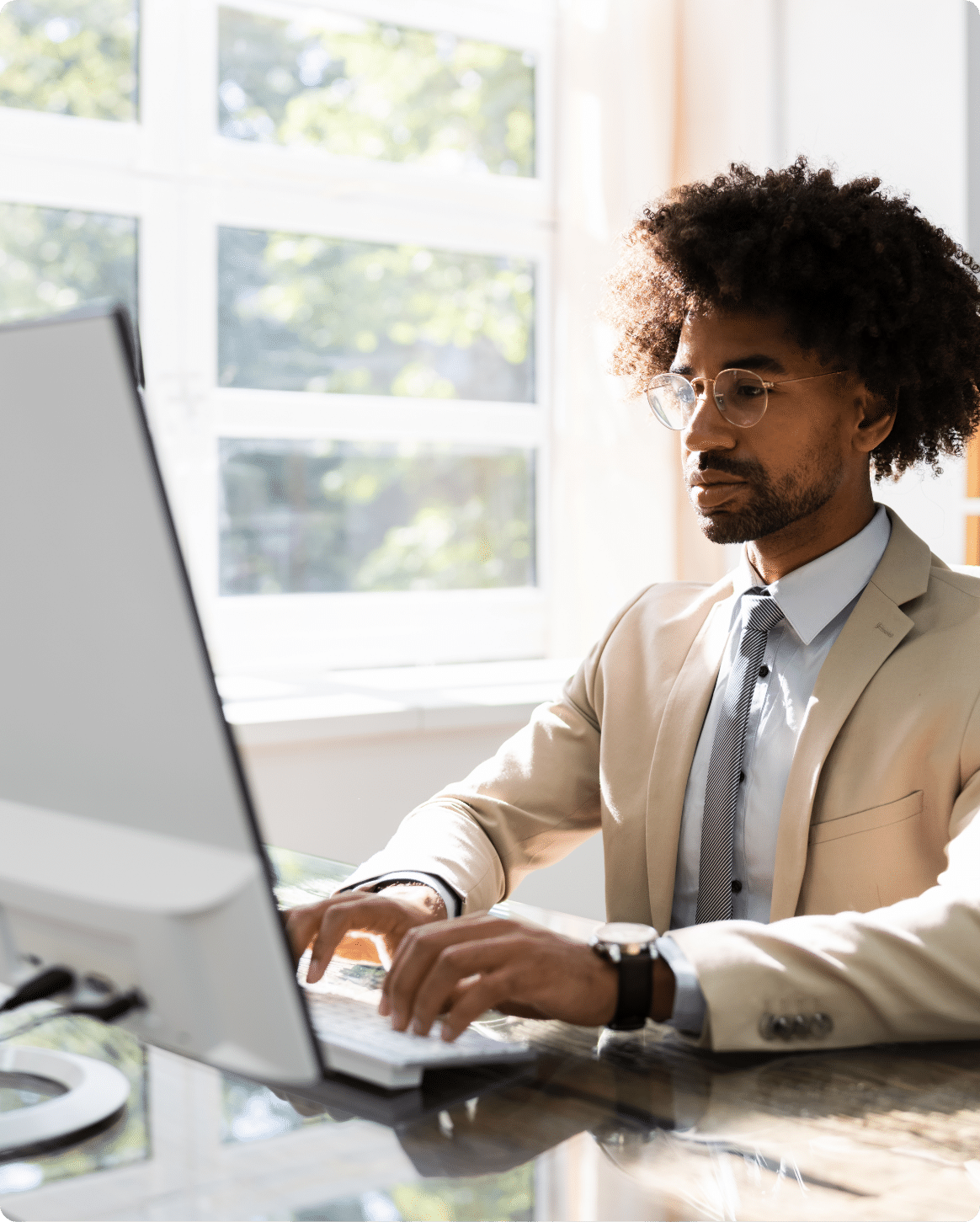 A man working for a Government Staffing Agency at his computer