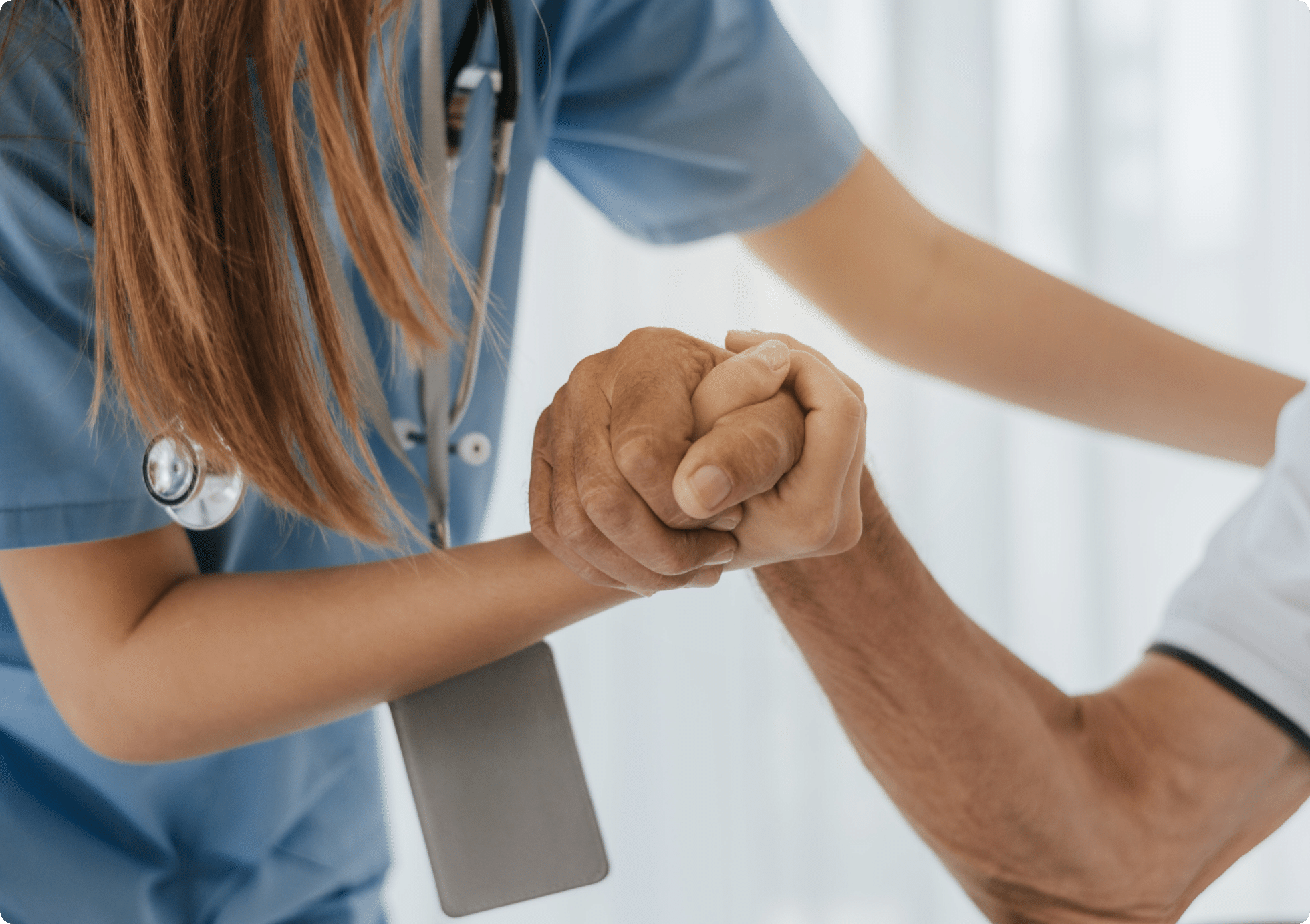 A woman nurse giving a helping hand to a Senior